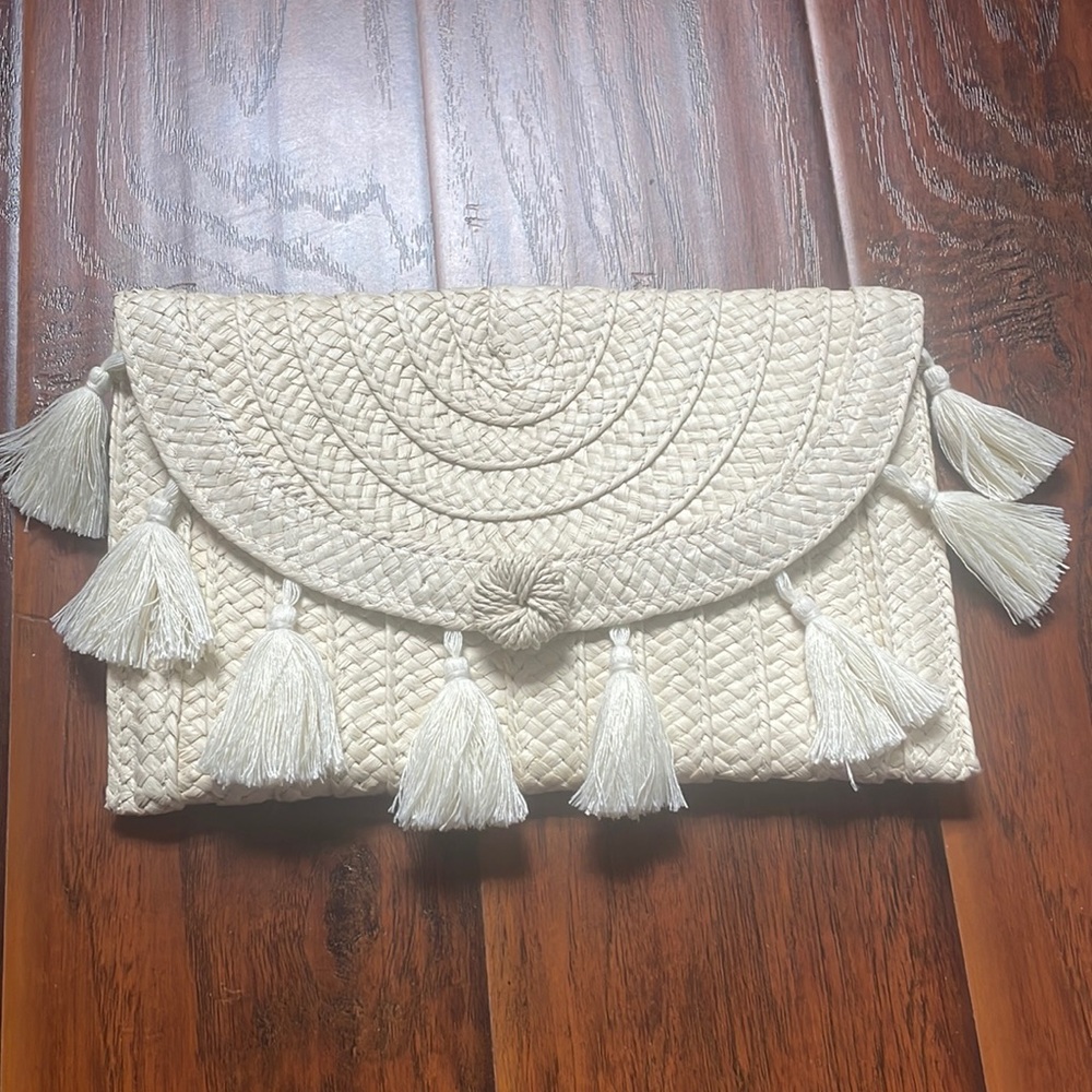 A new day tassel wrislet straw clutch
